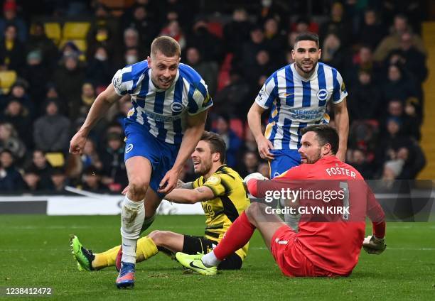 Brighton's English defender Adam Webster celebrates scoring his team's second goal during the English Premier League football match between Watford...