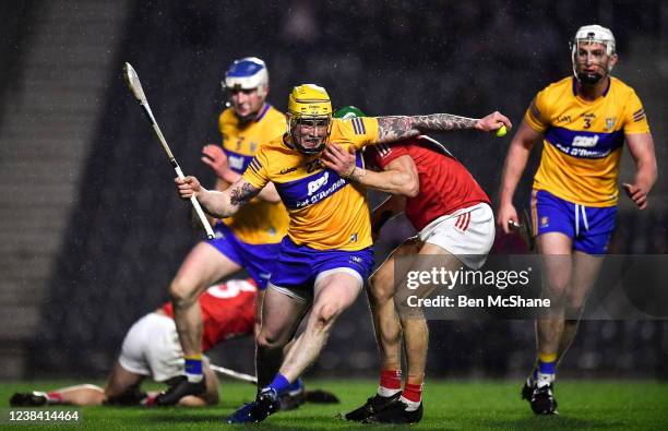 Cork , Ireland - 5 February 2022; Aaron Fitzgerald of Clare and Alan Cadogan of Cork during the Allianz Hurling League Division 1 Group A match...