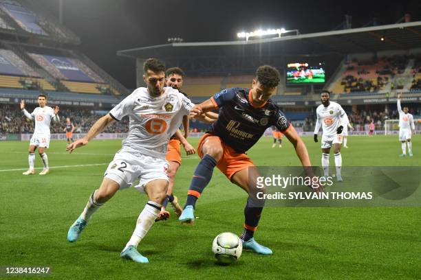 Montpellier's US forward Nicolas Gioacchini challenges Lille's Turkish defender Zeki Celik during the French L1 football match Montpellier vs Lille...