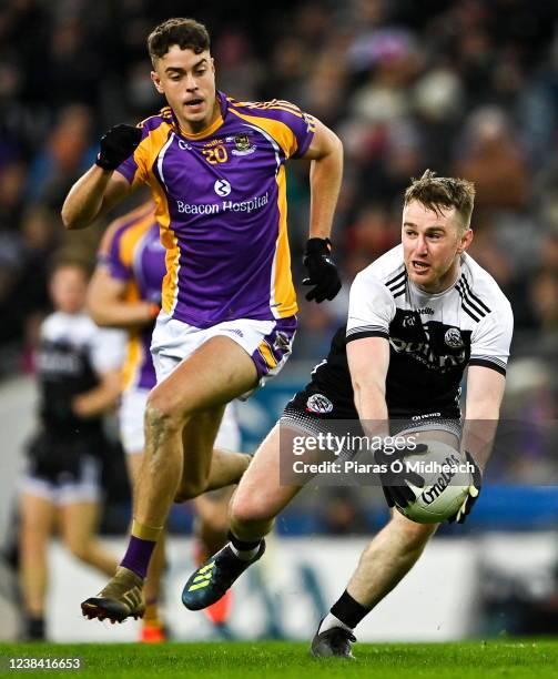 Dublin , Ireland - 12 February 2022; Paul Devlin of Kilcoo in action against Conor Casey of Kilmacud Crokes during the AIB GAA Football All-Ireland...