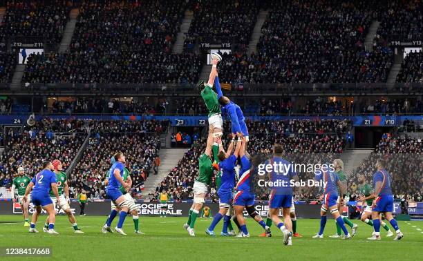 Paris , France - 12 February 2022; James Ryan of Ireland wins possession in the lineout against Cameron Woki of France during the Guinness Six...