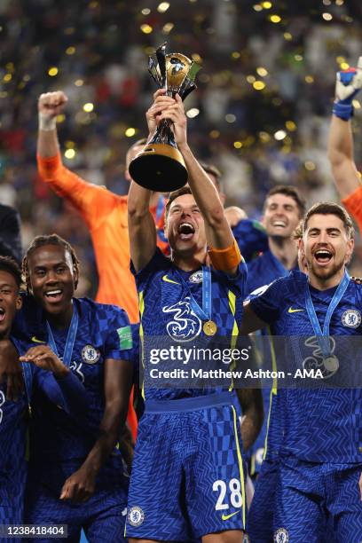 Cesar Azpilicueta of Chelsea lifts the FIFA Club World Cup UAE 2021 trophy and celebrates winning with team mates during the FIFA Club World Cup UAE...