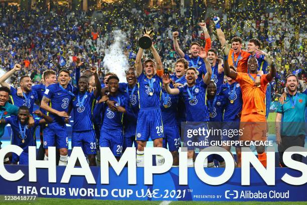 Chelsea's players celebrate with their trophy after winning the 2021 FIFA Club World Cup final football match against Brazil's Palmeiras at Mohammed...