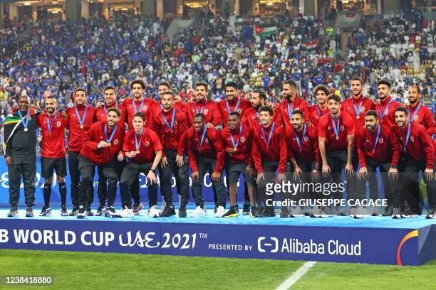 Al-Ahly's players celebrate their bronze medals at the end of the 2021 FIFA Club World Cup final football match between Brazil's Palmeiras and...