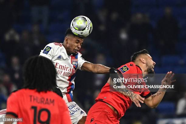 Lyons Brazilian midfielder Thiago Mendes fight for the ball with Nices Algerian forward Andy Delort during the French L1 football match between...