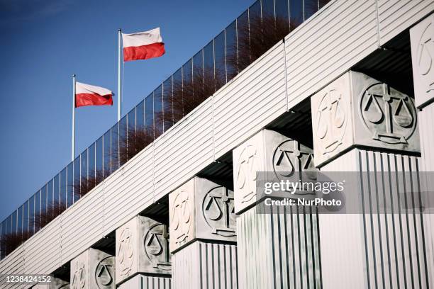 Polish flags are seen flying on the roof of the Supreme Court in Warsaw, Poland on 12 February, 2022. Poland has conceded to disolve the...