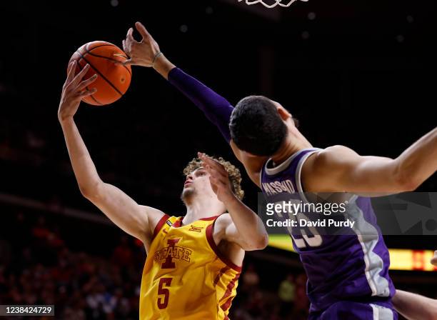 Aljaz Kunc of the Iowa State Cyclones battles for a rebound with Ismael Massoud of the Kansas State Wildcats in the second half of play at Hilton...