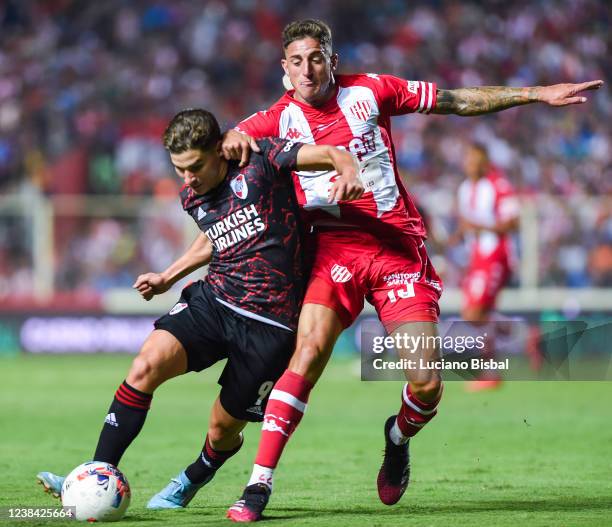 Julián Álvarez of River Plate and Gastón González of Unión fight for the ball during a match between Union and River Plate as part of Copa de la Liga...