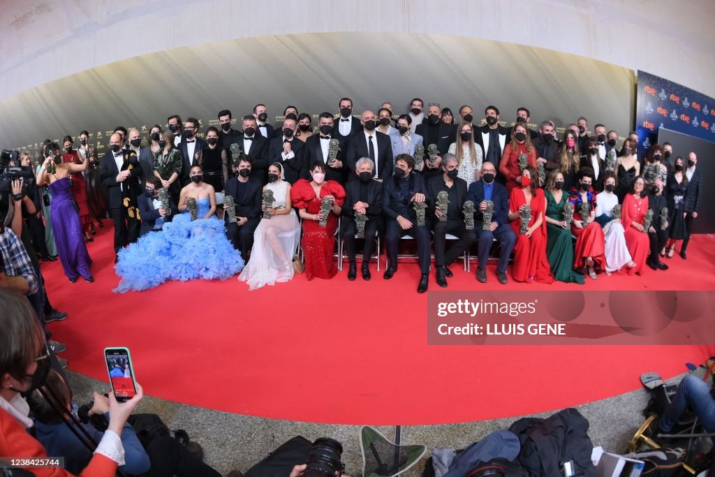 Award winners pose for a family picture with their Goya awards during