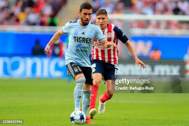 Luis Olivas of Chivas fights for the ball with Juan Vigon of Tigres during the 5th round match between Chivas and Tigres UANL as part of the Torneo...