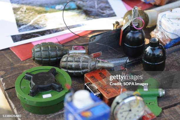 Mines and grenades on show during an open military training for civilians organized by the Lviv Region Defence HQ at the Lviv skeet shooting range as...