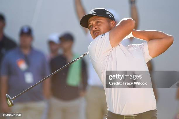 Xander Schauffele hits his tee shot at the 17th hole during the third round of the WM Phoenix Open at TPC Scottsdale on February 12, 2022 in...