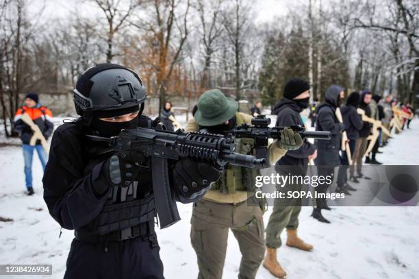 Ukrainians attend an open military training for civilians range as part of the " Don't panic! Get ready! " which is carried out by veterans of the...