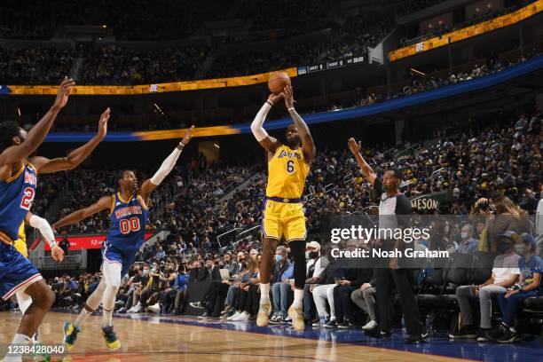 LeBron James of the Los Angeles Lakers shoots a three point basket to become the all-time leading scorer in the NBA during the game against the...