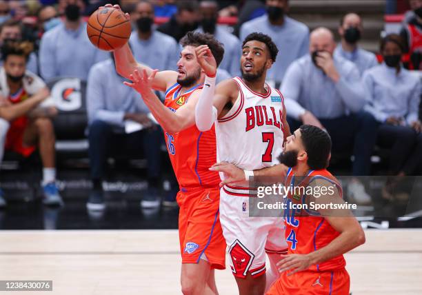 Oklahoma City Thunder guard Ty Jerome and Chicago Bulls forward Troy Brown Jr. Both react to a rebound during a NBA game between the Oklahoma City...