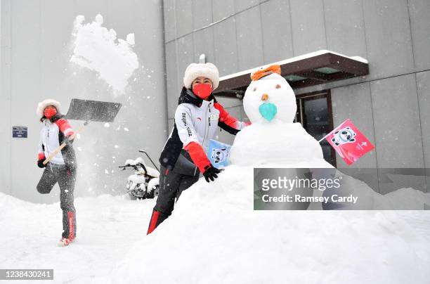 Yanqing , China - 13 February 2022; Volunteers play with a snowman during a break in the Men's Giant Slalom event on day nine of the Beijing 2022...