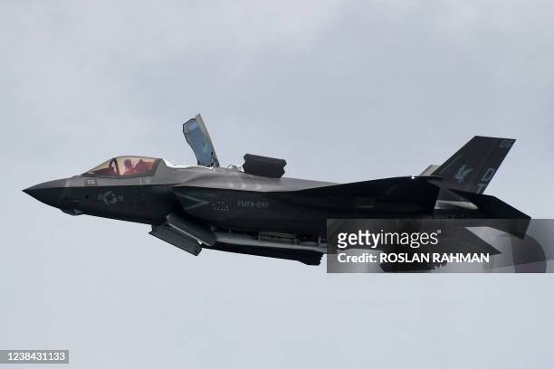 Marine Corps F-35B Lightning II, a short takeoff and vertical landing version of the Joint Strike Fighter aircraft, flies past during a preview of...