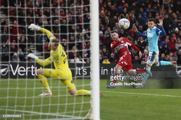 Middlesbrough's Aaron Connolly has a shot turned wide by Derby County Goalkeeper Ryan Allsop during the Sky Bet Championship match between...