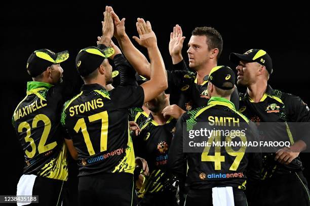 Australian players celebrate the dismissal of Sri Lanka's batsman Avishka Fernando off paceman Josh Hazlewood during the second T20 international...