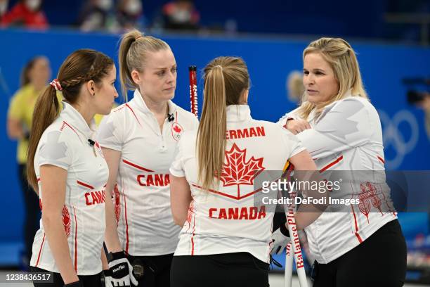 Lisa Weagle of Canada, Dawn McEwen of Canada, Joselyn Peterman of Canada and Jennifer Jones of Canada speaks with the women's Curling session 6...