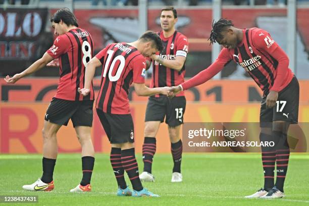 Milan's Portuguese forward Rafael Leao celebrates after scoring during the Italian Serie A football match between AC Milan and Sampdoria at the...