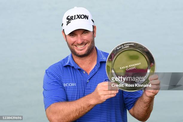 Ryan Fox of New Zealand poses with the trophy following his victory during day four of the Ras Al Khaimah Classic at Al Hamra Golf Club on February...