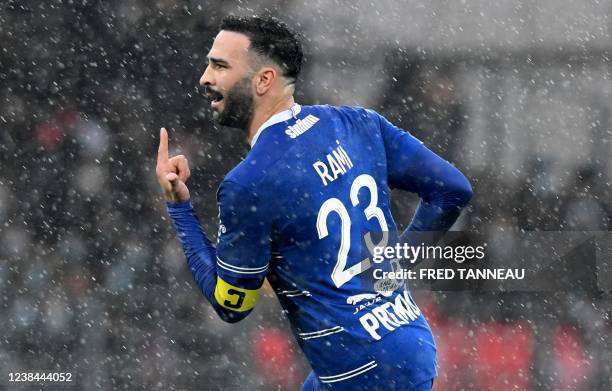 Troyes' French defender Adil Rami celebrates after scoring a goal during the French L1 football match between Stade Brestois 29 and Troyes at the...