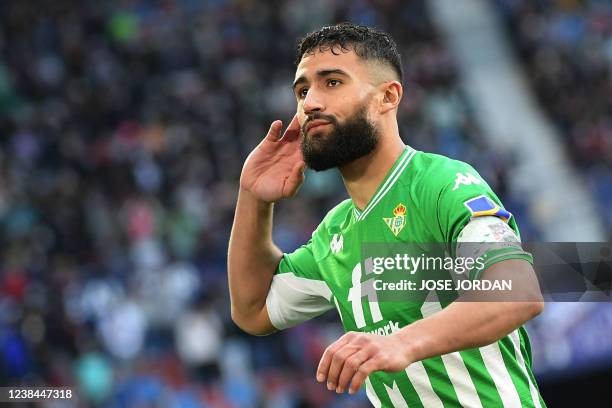 Real Betis' French midfielder Nabil Fekir celebrates after scoring a goal during the Spanish league football match between Levante UD and Real Betis...