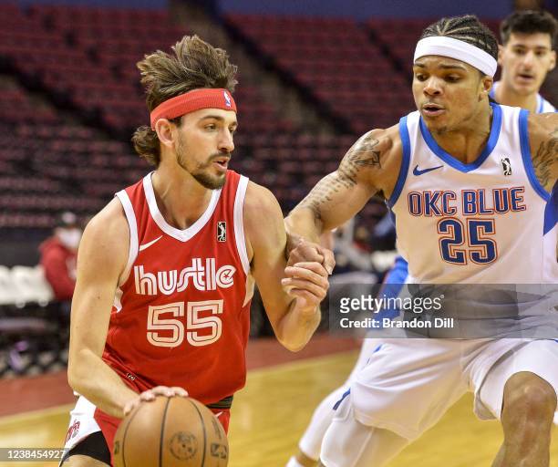 David Stockton of the Memphis Hustle handles the ball against Rob Edwards of the Oklahoma City Blue during an NBA G-League game on February 13, 2022...