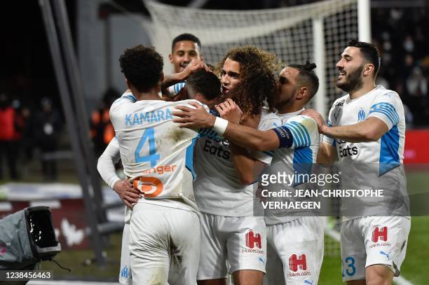 Marseille's players celebrate after a goal scored by Marseille's Polish forward Arkadiusz Milik during the French L1 football match between Metz and...