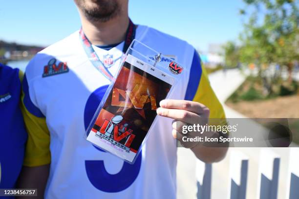 Rams fan holds up his game ticket on a lanyard prior to Super Bowl LVI between the Cincinnati Bengals and the Los Angeles Rams on February 13 at SoFi...