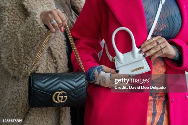 Detail photo of Kristian Spraggins handbag by Gucci and Morgan Fitzpatrics handbag by Jacquemus at Spring Studios during New York Fashion Week on...