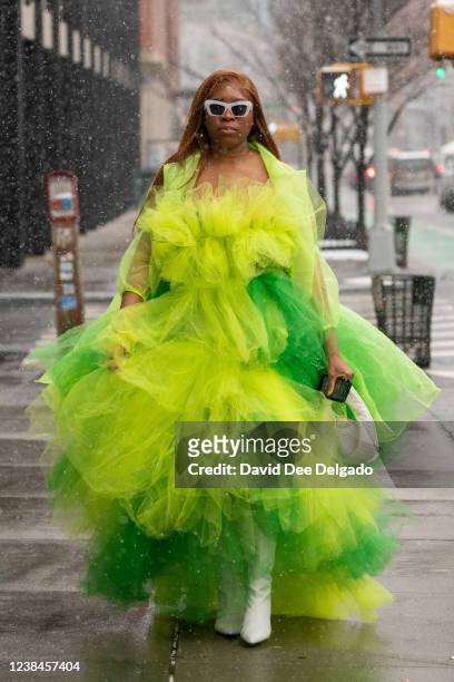 Melody Asherman wears a dress of her own design, shoes by Shoe Dazzle and handbag by Mleada & Kou to New York Fashion Week at Spring Studios on...