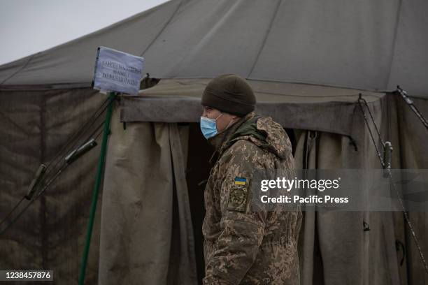 Soldier enters a medical tent at the 66th mobile military hospital in Pokrovsk, Ukraine, about 25 miles from the Eastern frontlines. The Unit...