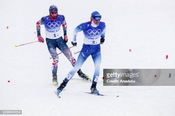 Maurice Manificat of France and Johannes Hosflot Klaebo of Norway are seen during the Men's Cross-Country Skiing 4x10km Relay on Day 9 of the Beijing...
