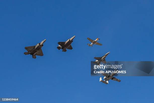 Five aircraft representing the US Air Forces 75 years as a service, fly over SoFi Stadium at the end of the national anthem and kickoff of Super Bowl...