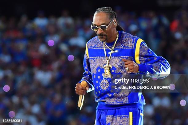 Rapper Snoop Dogg performs during the halftime show of Super Bowl LVI between the Los Angeles Rams and the Cincinnati Bengals at SoFi Stadium in...