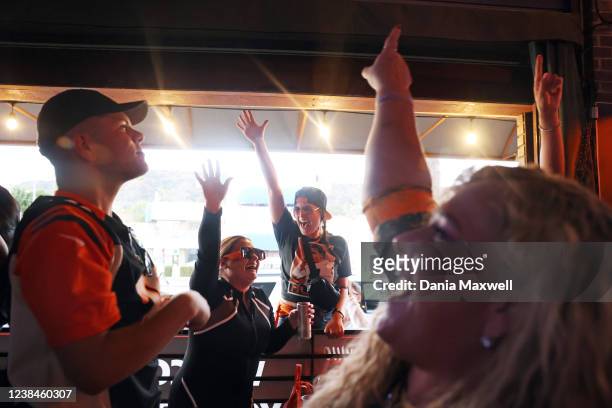 Ethan Quick, Desiree Maynard, Steph DArrigo and Julie Marshall, left to right, celebrate Bengals scoring during a watch party for the Superbowl at 5...