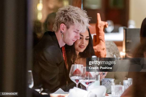 Megan Fox and fiance Colson Baker are seen eating and flirting at the Restaurant Grill Royal on February 13, 2022 in Berlin, Germany. Megan Fox and...