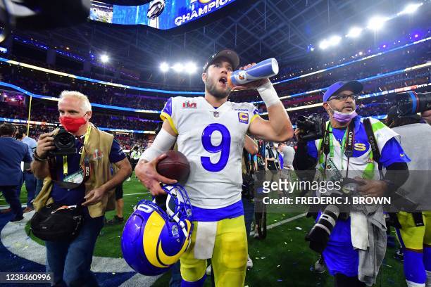 Los Angeles Rams' quarterback Matthew Stafford drinks water as he walks off the field after the LA Rams won Super Bowl LVI between the Los Angeles...