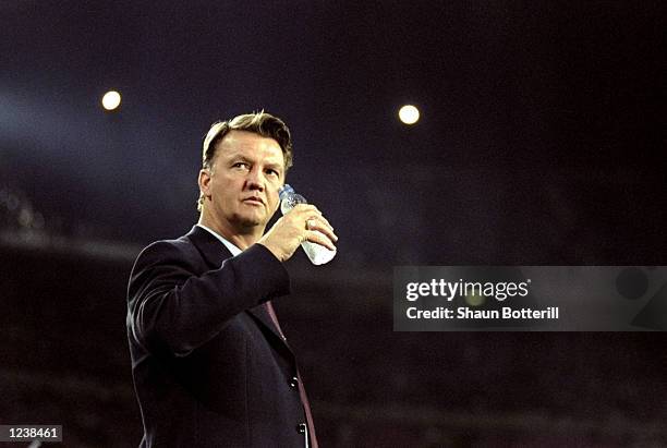 Barcelona coach Louis van Gaal watches his team in action during the Barcelona v Arsenal UEFA Champions League Group B match played at the Nou Camp,...