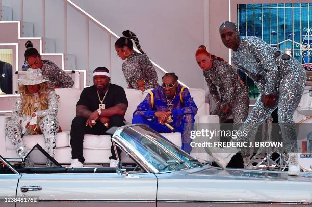 Singer-songwriter Mary J. Blige, US rapper 50 Cent and US rapper Snoop Dogg perform during the halftime show of Super Bowl LVI between the Los...