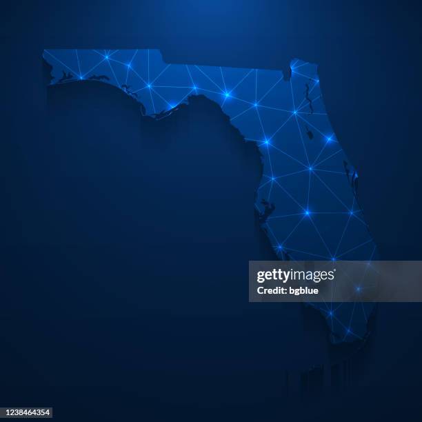 florida map network - bright mesh on dark blue background - florida outline stock illustrations