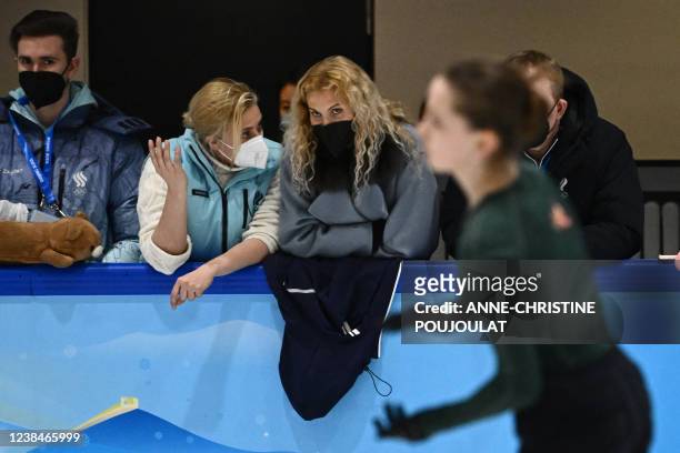 Russia's Kamila Valieva and her coach Eteri Tutberidze attend a training session on February 14, 2022 prior the figure skating event at the Beijing...