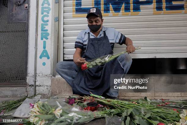 Rose seller offers his wares for Valentine's Day or the Day of Love and Friendship in the streets of Iztapalapa, Mexico City, during the COVID-19...