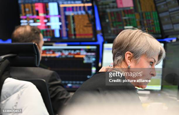 February 2022, Hessen, Frankfurt/Main: An ICF Bank stock trader watches her monitors on the floor of the Frankfurt Stock Exchange. The Ukraine...