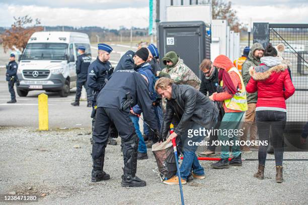 Protesters have their backpacks checked before leaving on Parking C of the Heizel - Heysel expo area, at a protest action against corona-measures...