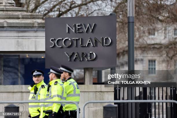 Britain's police officers patrol in front of Scotland Yard, central London, on February 14, 2022.