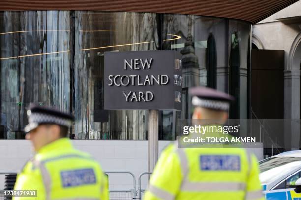 Britain's police officers patrol in front of Scotland Yard, central London, on February 14, 2022.
