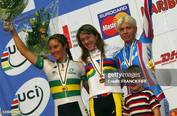 Russian bronze medallist Olga Slusareva, Czech gold medallist Lada Kozlikova and Australian silver medallist Rochelle Gilmore celebrate on the podium...